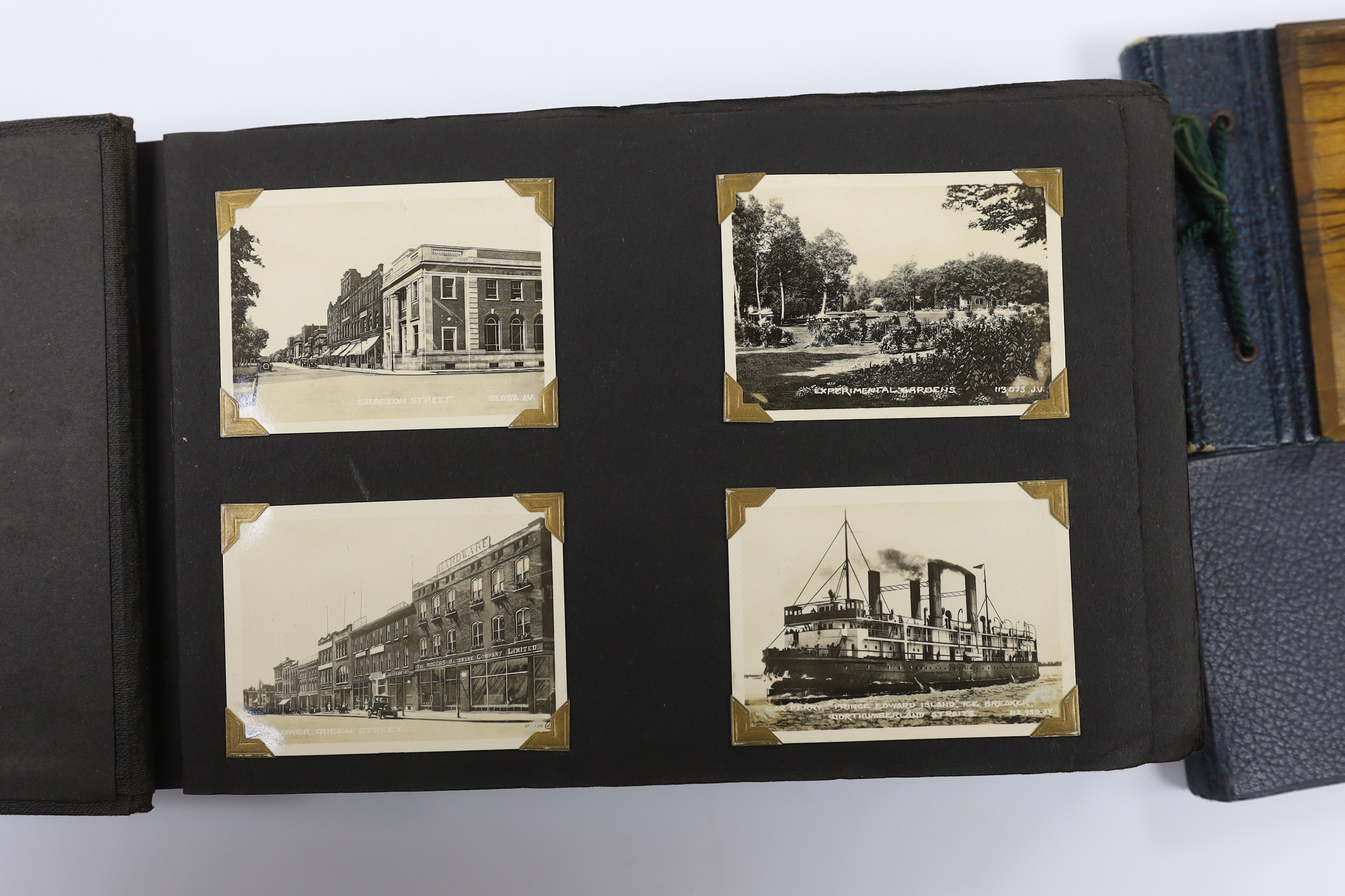 Two albums of early 20th century postcards and black and white photographs, many with naval interest, including photographs of battleships, and naval manoeuvres, during the 1930s, scenes of Bermuda, portraits of soldiers
